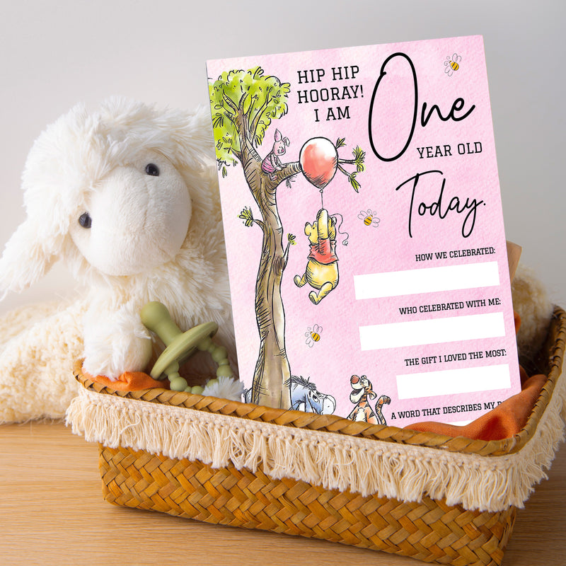 a stuffed animal sitting next to a book in a basket