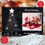 a christmas card with a picture of two children sitting in front of a christmas tree