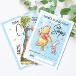 two winnie the pooh birthday cards on a table