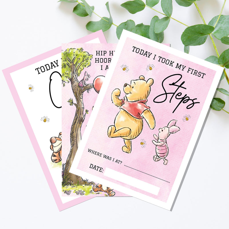 two winnie the pooh birthday cards on a table