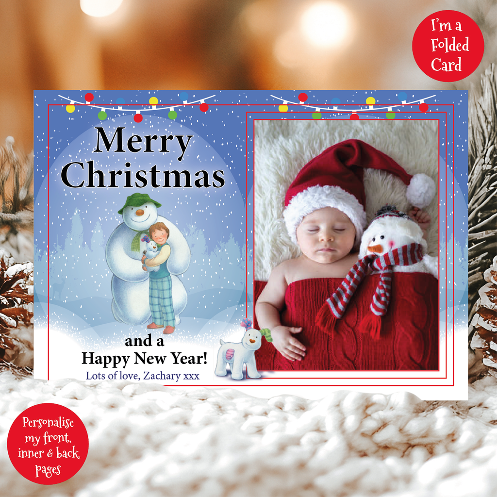 a christmas card with a picture of a baby and a snowman