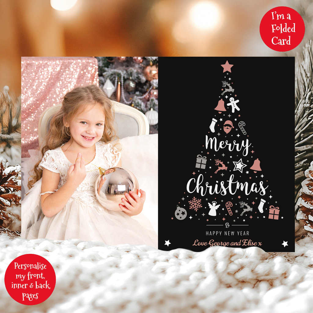 a christmas card with a photo of a girl holding a bauble